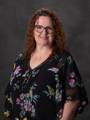 Woman with curly brown hair