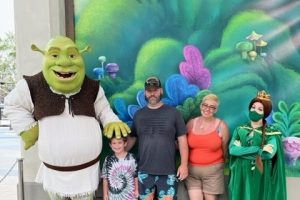 Family of three with cartoon characters