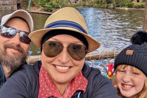 Man, Woman, and Child on Boat