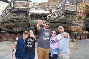 Five people in front of the Millennium Falcon at Disneyworld