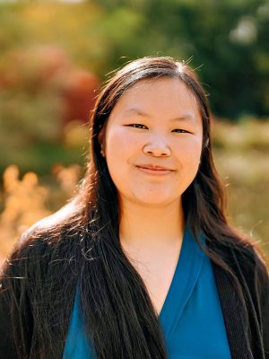 Woman in Blue Shirt with brown hair