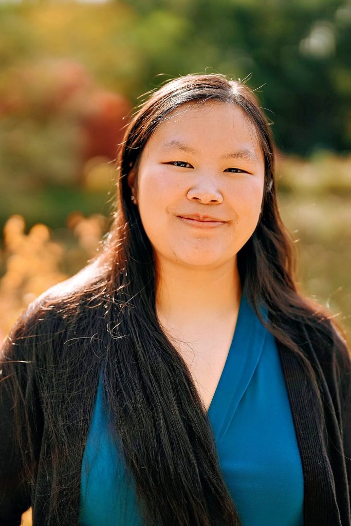 Woman in Blue Shirt with brown hair