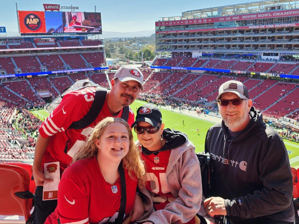 Four people at a football game