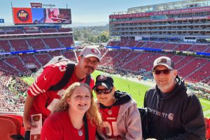 Four people at a football game