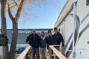 Four people standing on a ramp