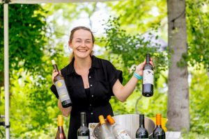 woman holding wine bottles