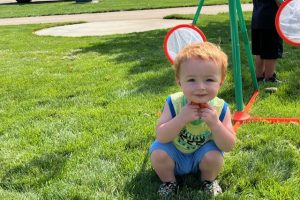 little boy crouching
