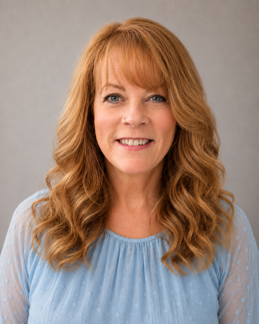 woman with red hair and blue shirt