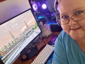 A woman sitting in front of a computer system