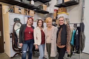 four women standing next to each other