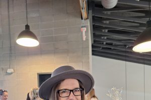 woman smiling with hat on