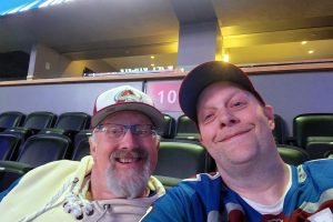 Two men at a hockey game