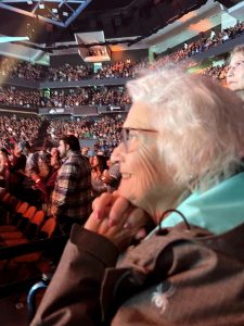 A woman with white hair at a concert