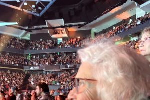 A woman with white hair at a concert
