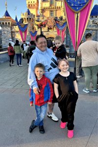 A woman and three children at Disneyland