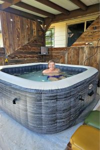 Woman sitting in a hot tub