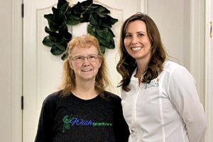 Two women, one with a Wish Granters t-shirt