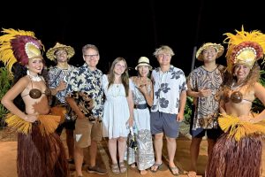 A family of four at a Hawaiian luau