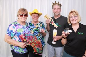 Four people in a photo booth