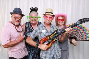 Four people in a photo booth