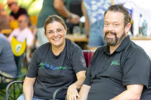 Two people wearing Wish Granters shirts