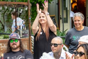 People clapping at a charity event