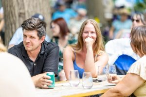 Two people sipping wine