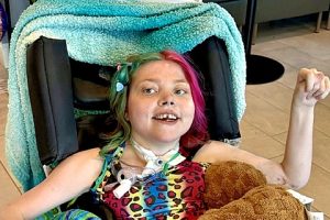 A girl in a wheelchair